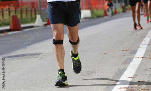athletic runner with the elastic band while running