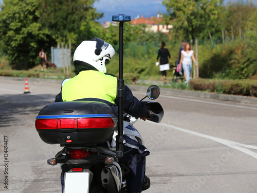 policeman with helmet on the police motorcycle