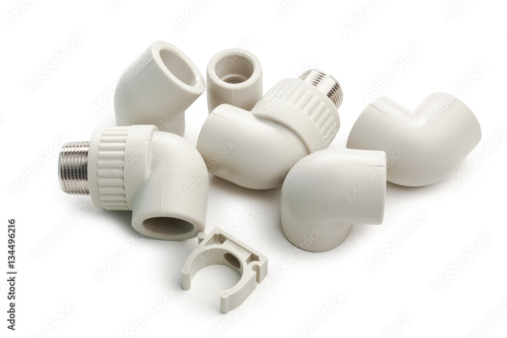 Set of metal-plastic plumbing couplings, adapters, plugs isolated on white background Set of metal-plastic plumbing couplings, adapters, plugs isolated on white background
