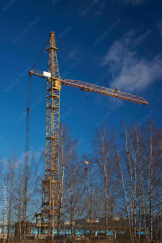 Construction crane against blue sky. Construction crane against blue sky.