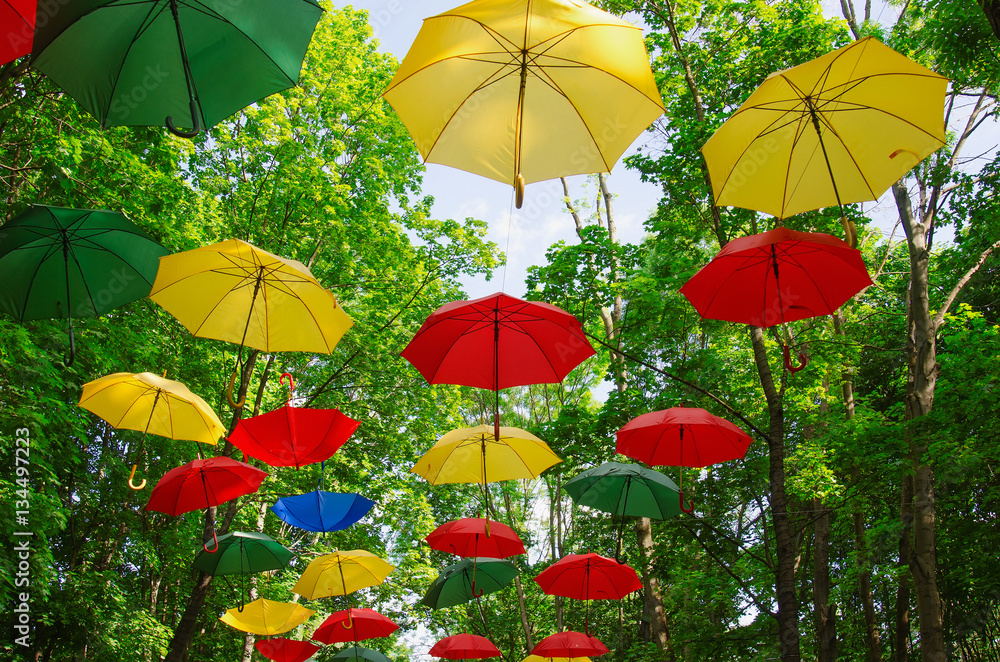 RUSSIA, MOSCOW REGION.Colorful umbrellas in the sky. Street decoration in the park