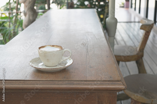 Fototapeta Naklejka Na Ścianę i Meble -  Close up white cup of Coffee, latte on the wooden table