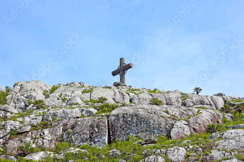 Stone cross on the top of the hill Pan de Azúcar, Uruguay photo