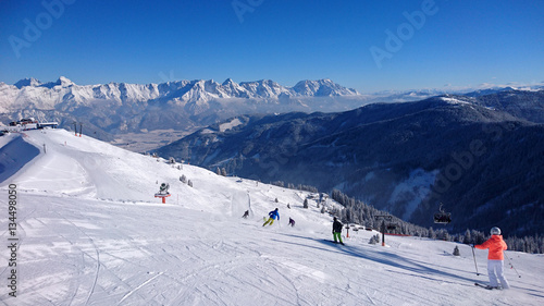 Sunny day on the ski slopes in Saalbach Hinterglemm, Austria photo