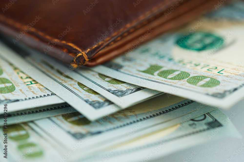 Brown leather wallet with USA dollars money Brown leather wallet with USA dollars money