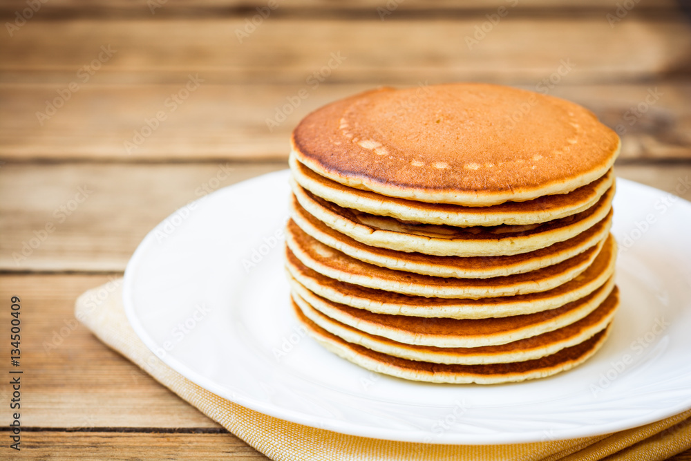 Pancakes on rustic wooden background Pancakes on rustic wooden background