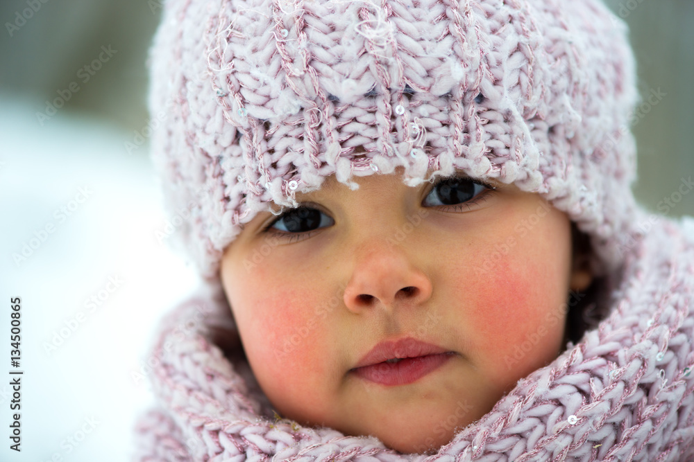 Little girl in winter season with red cheeks Little girl in winter season with red cheeks