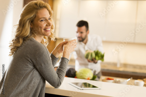Young couple preparing meal...