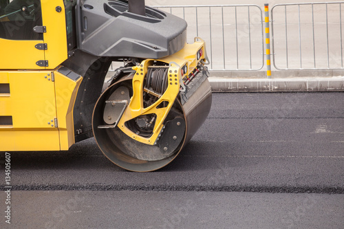 Heavy Vibration roller compactor at asphalt pavement works for road repairing © dechevm