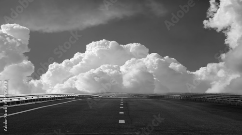 Free highway on a background of beautiful clouds. black and whit