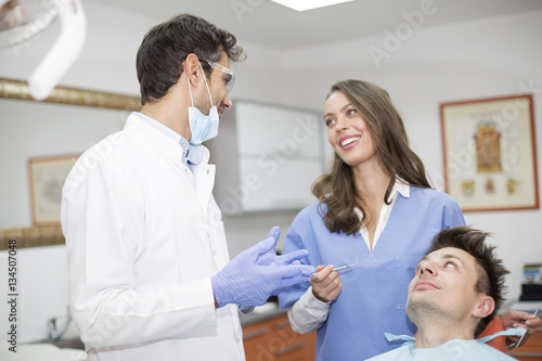 Young man having dental chekup at dentist office