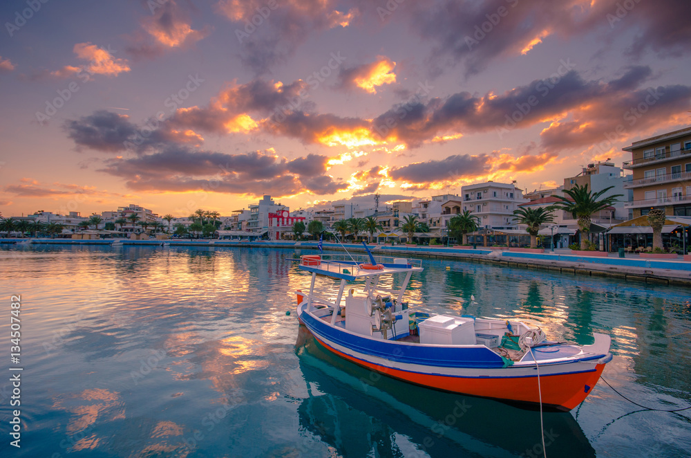 Fototapeta premium The pictursque port of Sitia, Crete at sunset. Sitia is a traditional town at the east Crete near the beach of palm trees, Vai. 