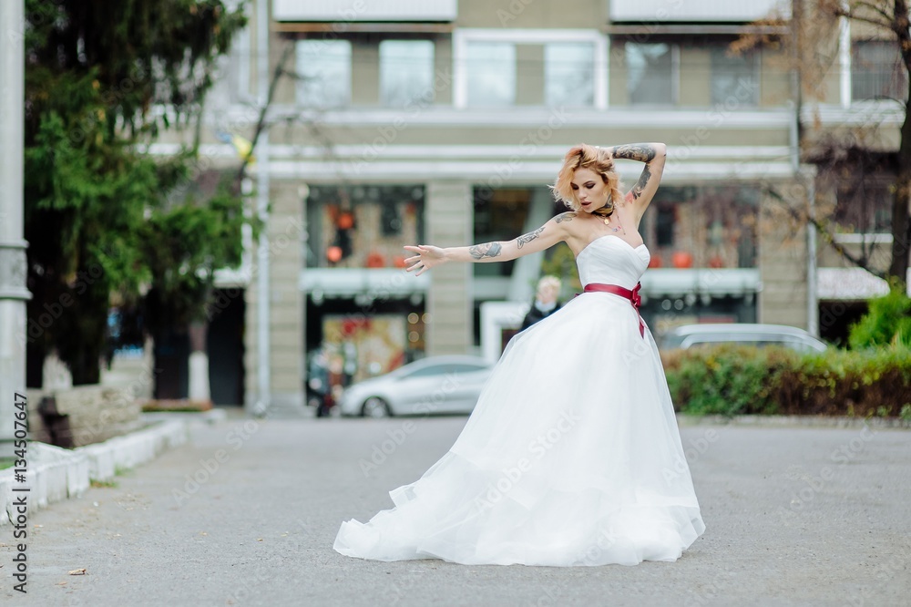 Beautiful bride with tattoo at wedding morning Beautiful bride with tattoo at wedding morning