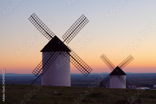  windmills at field in sunrise