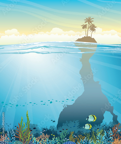 Underwater cave with coral reef and island.
