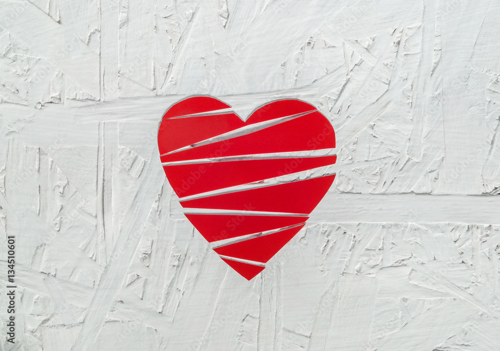 Paper broken heart on white wooden background Paper broken heart on white wooden background