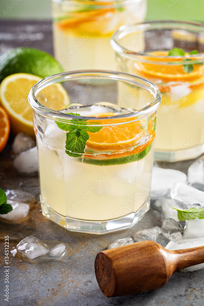 Refreshing summer cocktail with citrus fruits Refreshing summer cocktail with citrus fruits