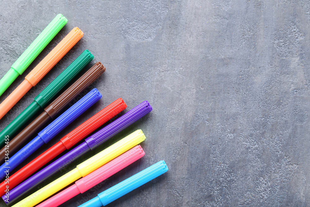 Felt-tip pens on a grey wooden table Felt-tip pens on a grey wooden table