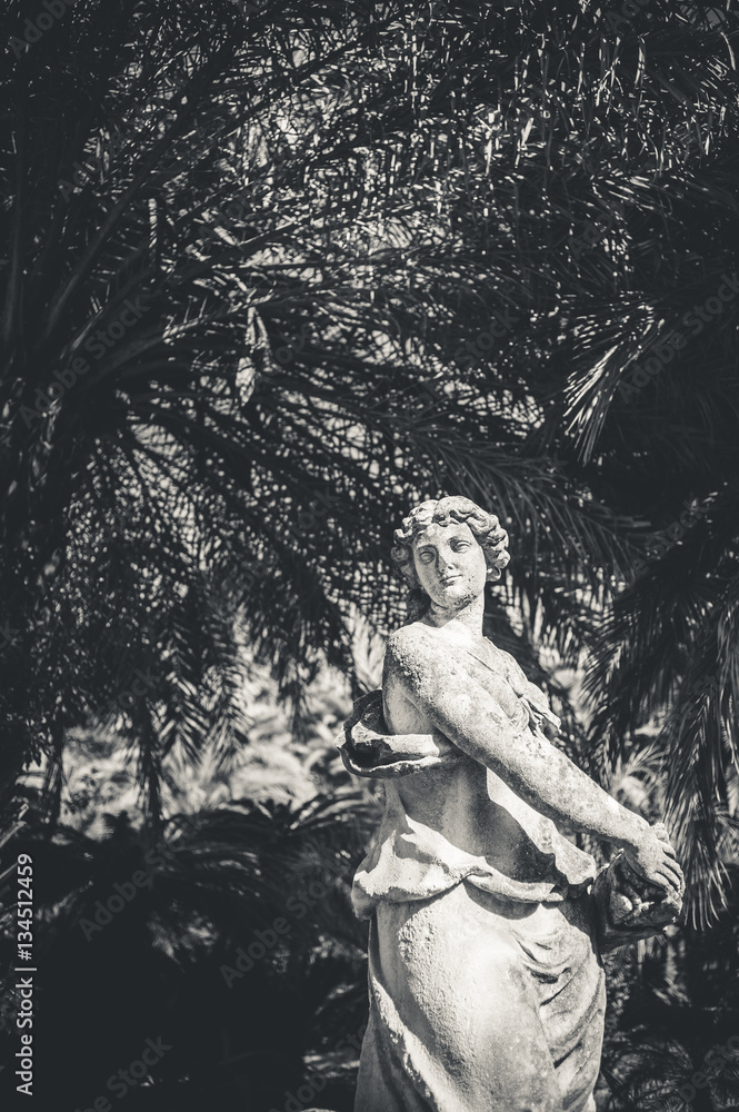old sculpture of a woman in the park old sculpture of a woman in the park