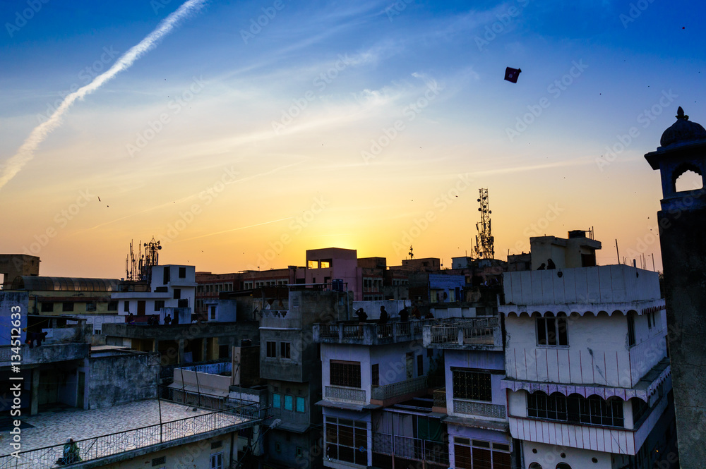 Houses and kites at sunset in jaipur