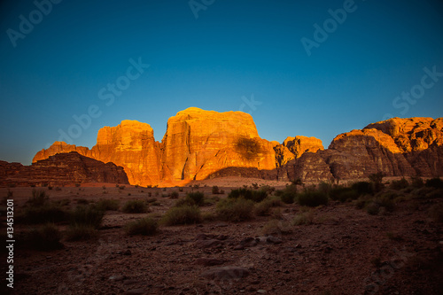 Amazing sunset on red rock in desert of Wadi Rum. Petra. Jordan