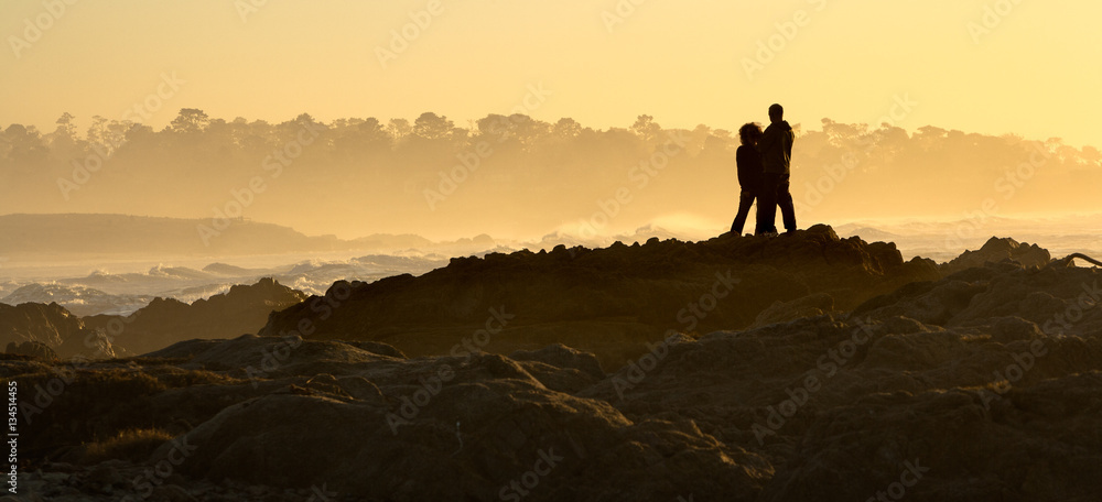 Young couple at Sunset at Asilomar State Beach near Monterey, Ca