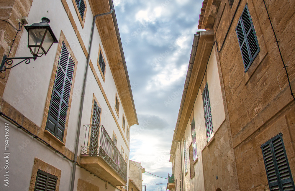 Beautiful narrow old street in mediterranean city.