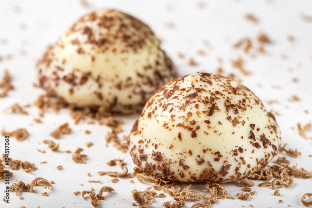 Two vanilla pearl candy and grated dark chocolate Two vanilla pearl candy and grated dark chocolate