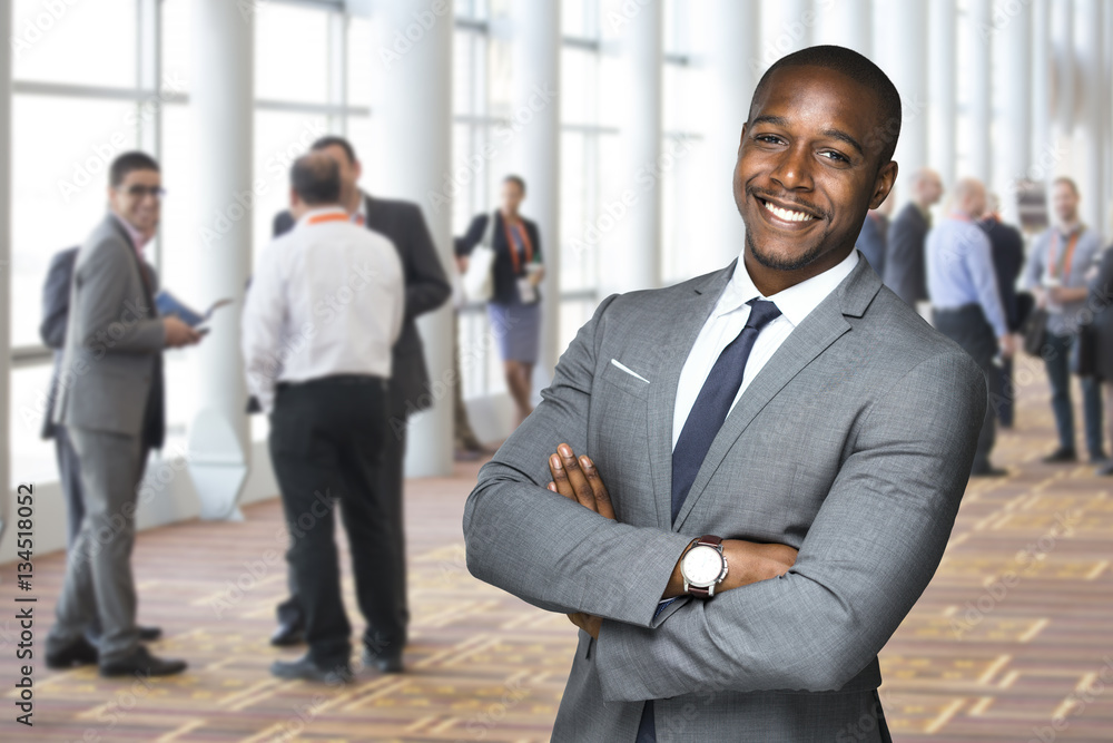 Corporate event portrait of an african american team worker enjoying social event Corporate event portrait of an african american team worker enjoying social event