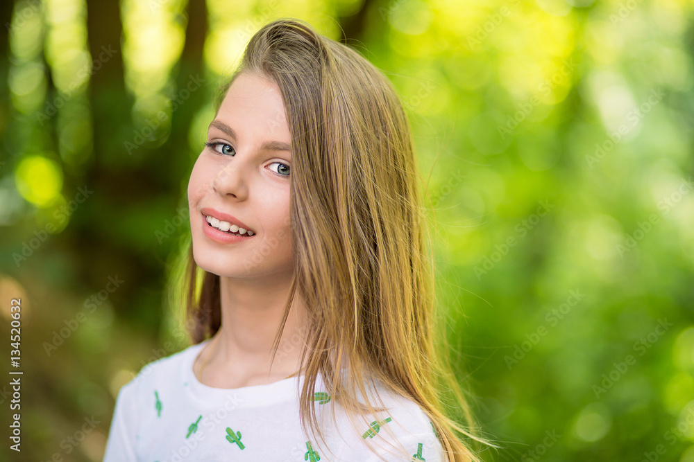Woman smiling with perfect smile and white teeth in a park and looking at camera. Woman smiling with perfect smile and white teeth in a park and looking at camera.