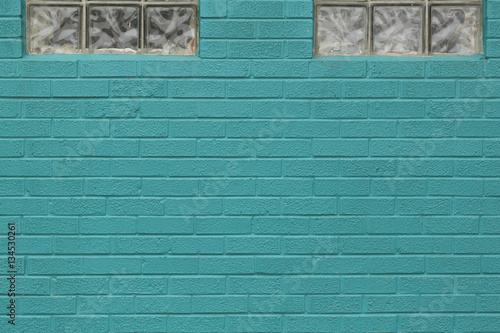 Turquoise Painted Brick Wall with Windows