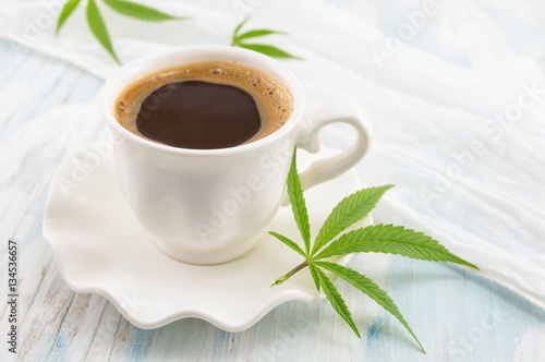 Canvas Print Hot coffee and marijuana leaves