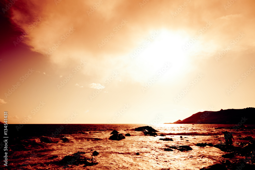 Fototapeta premium Sunset Over Rocky Beach