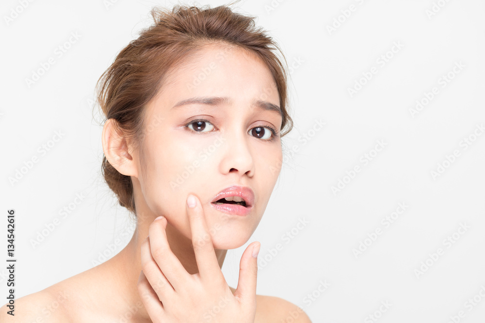 beauty girl of half latina and half asian who checks her skin, skin care, acne treatment