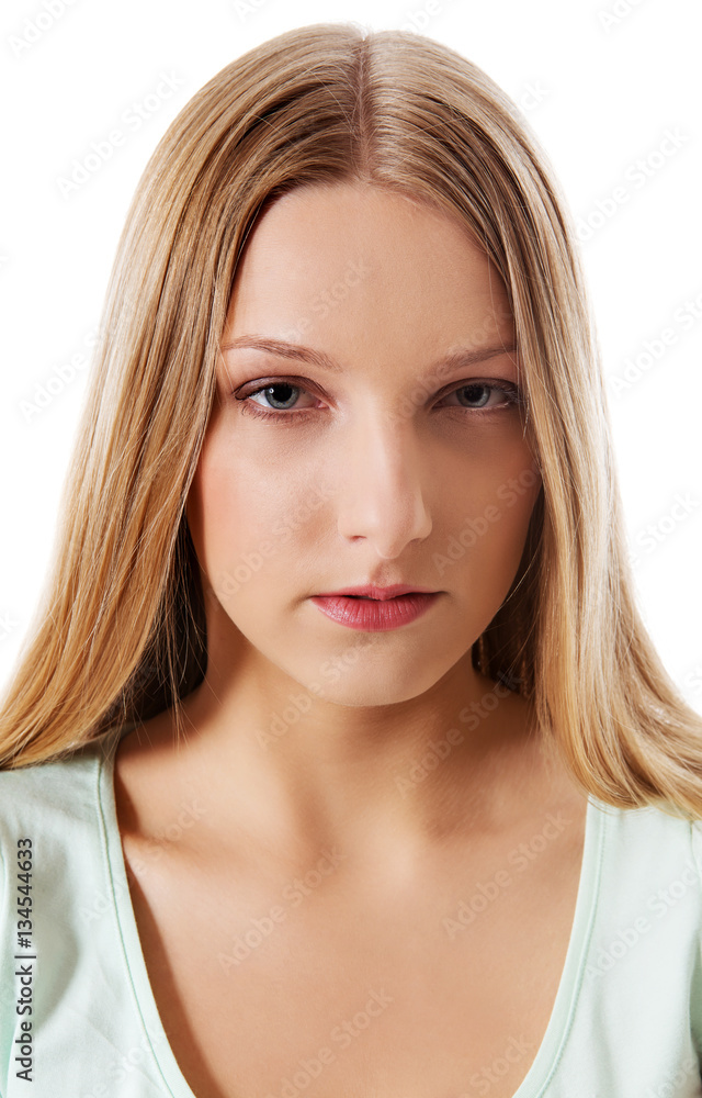 A young sad woman, isolated on white background.