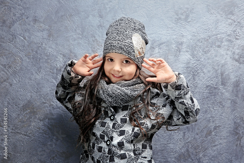 Cute little girl in warm cl...