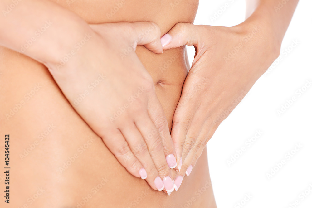 Hands on slim female belly Hands on slim female belly