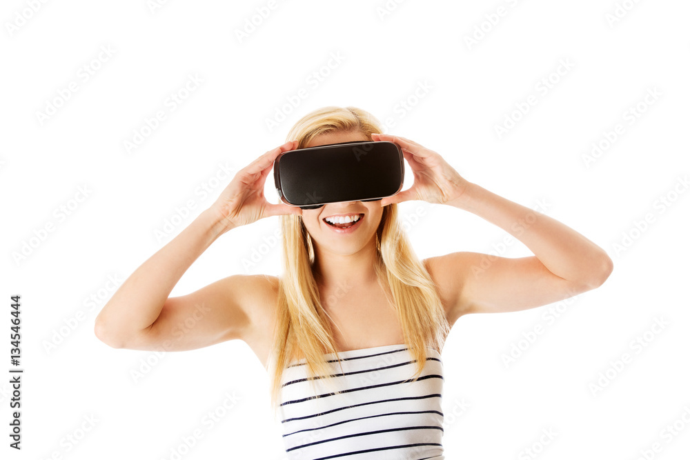 Girl wearing virtual reality goggles isolated on white. Girl wearing virtual reality goggles isolated on white.
