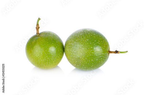 whole passion fruit with stem on white background