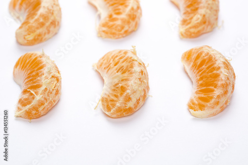 Peeled mandarin isolated on white background.