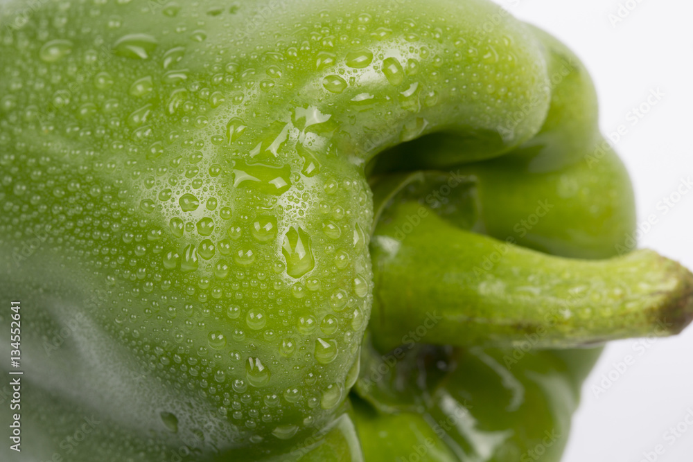 Fresh Green bell pepper closeup on white background. Fresh Green bell pepper closeup on white background.