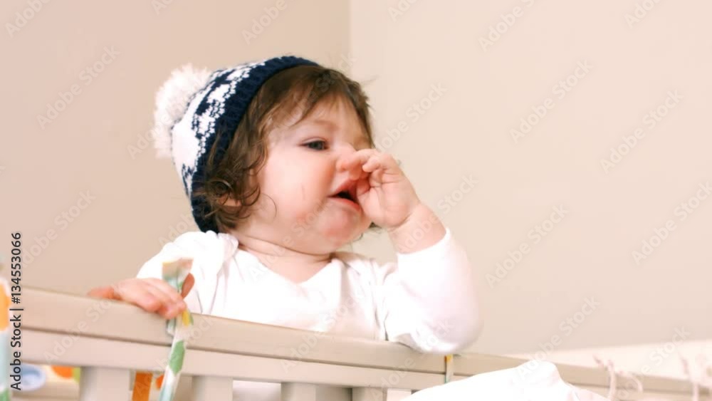 Close-up of cute baby girl in playing in baby cot 4k Close-up of cute baby girl in playing in baby cot 4k