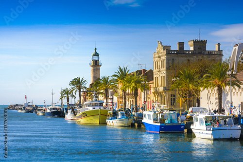 Grau du Roi city and harbor during a sunny day in France photo