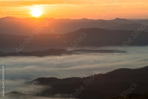 The beautiful landscape of the sea mist cover the highland mountains during the sunrise in northern region of Thailand.
