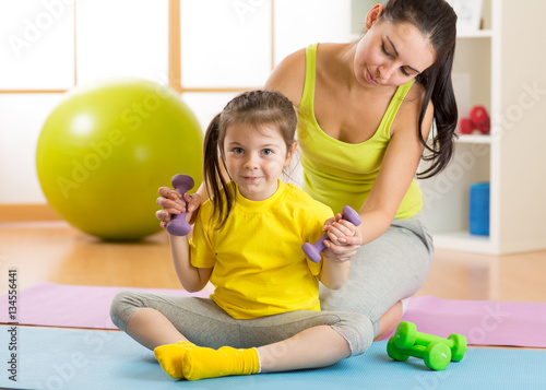 Mom and child daughter enga...