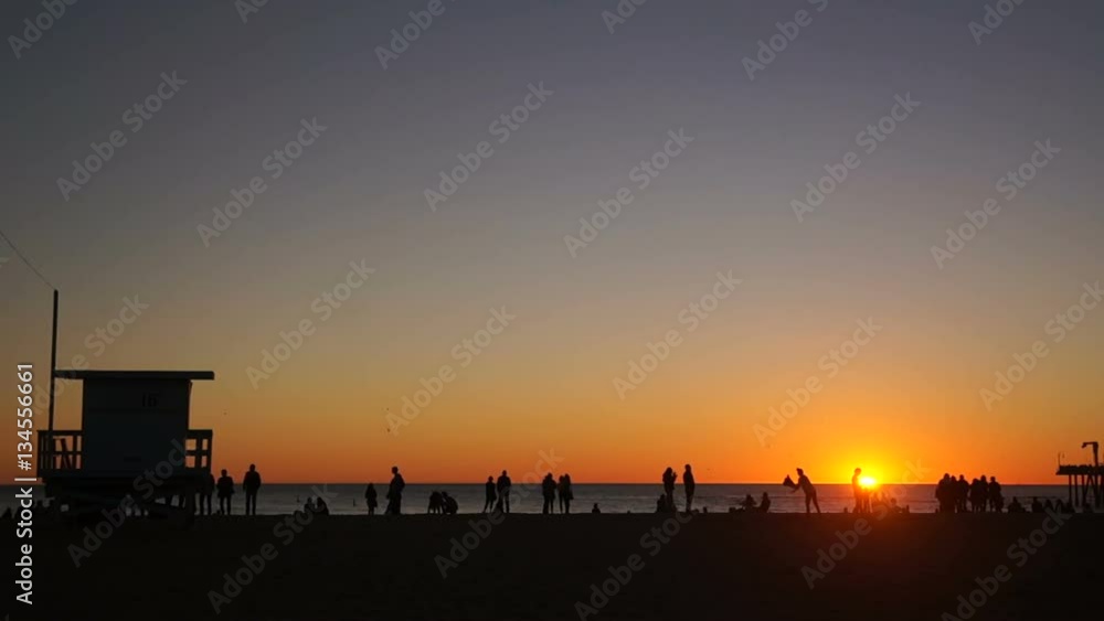 Sun Disappearing Over Horizon at Beach Sun Disappearing Over Horizon at Beach