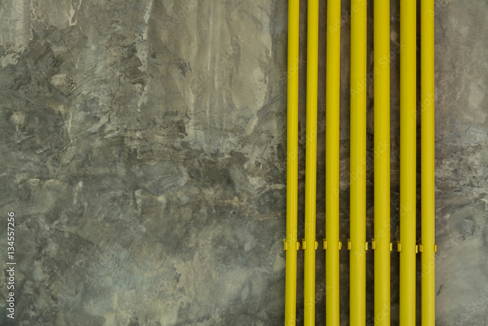 Yellow Pipe on Loft Grunge Wall Background