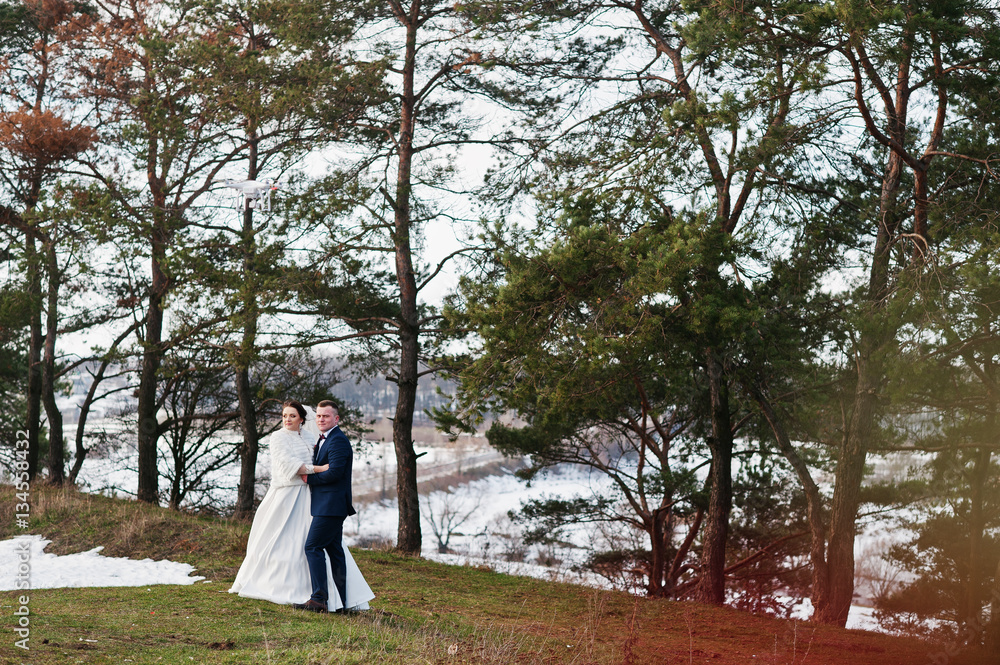Amazing young wedding couple in love at winter frost and sunny d Amazing young wedding couple in love at winter frost and sunny d