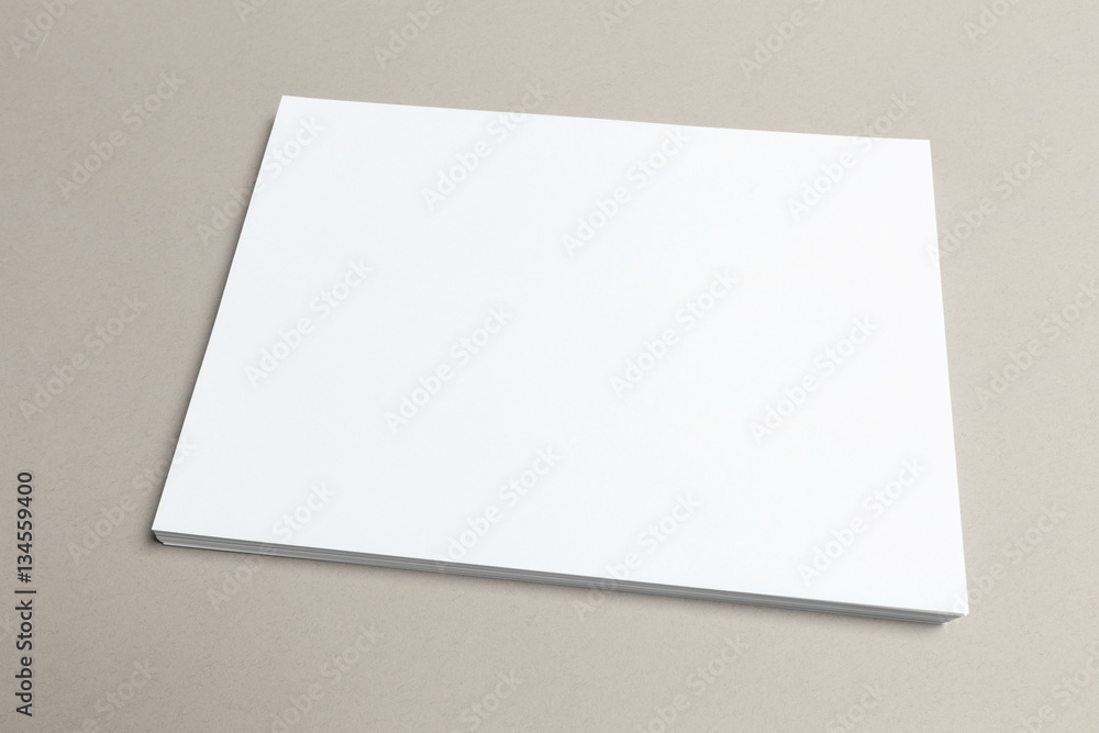 Blank paper on wood table Blank paper on wood table