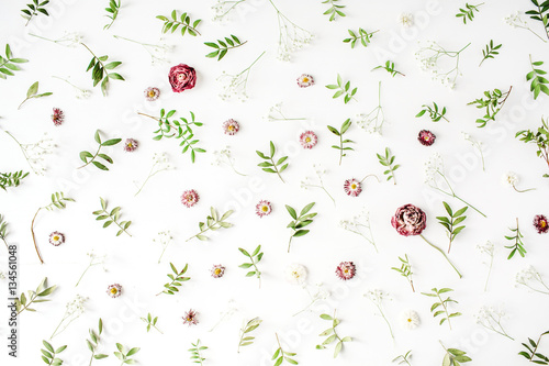 Floral texture. Pink roses and green leaves on white background. Flat lay, top view